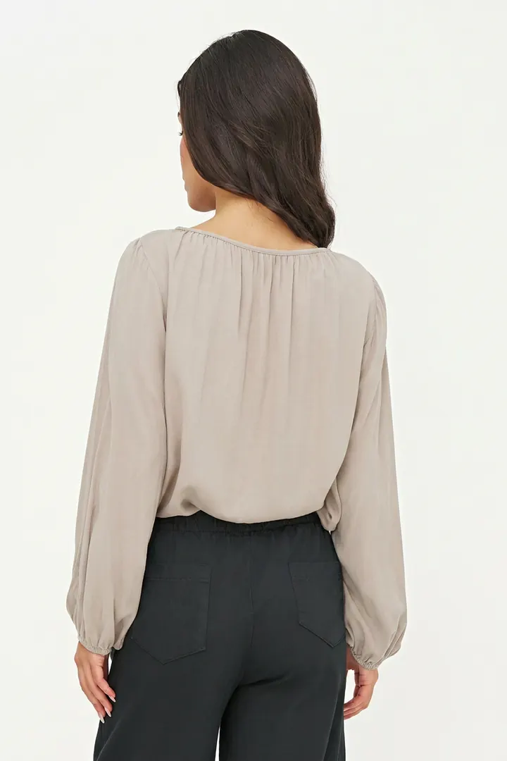 Warm greige blouse, back pose