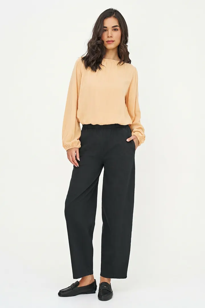 Pale apricot blouse, full length pose