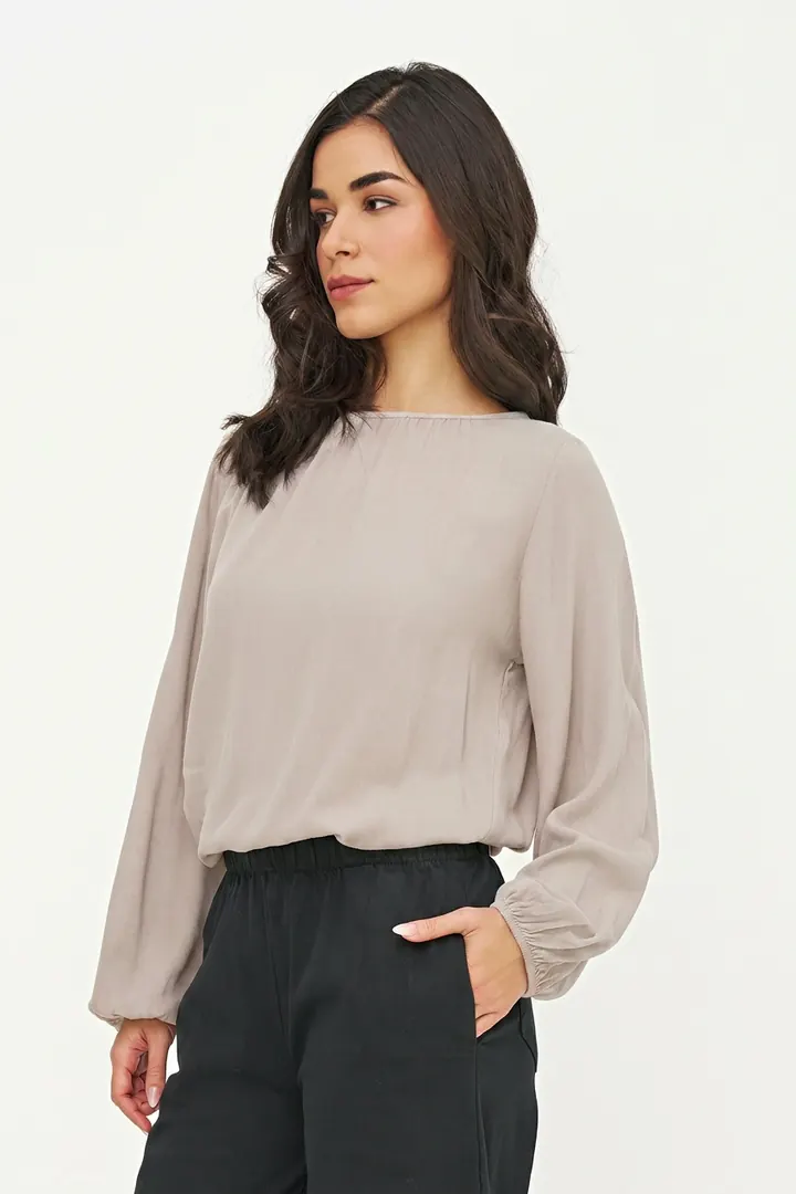 Warm greige blouse, three-quarter pose